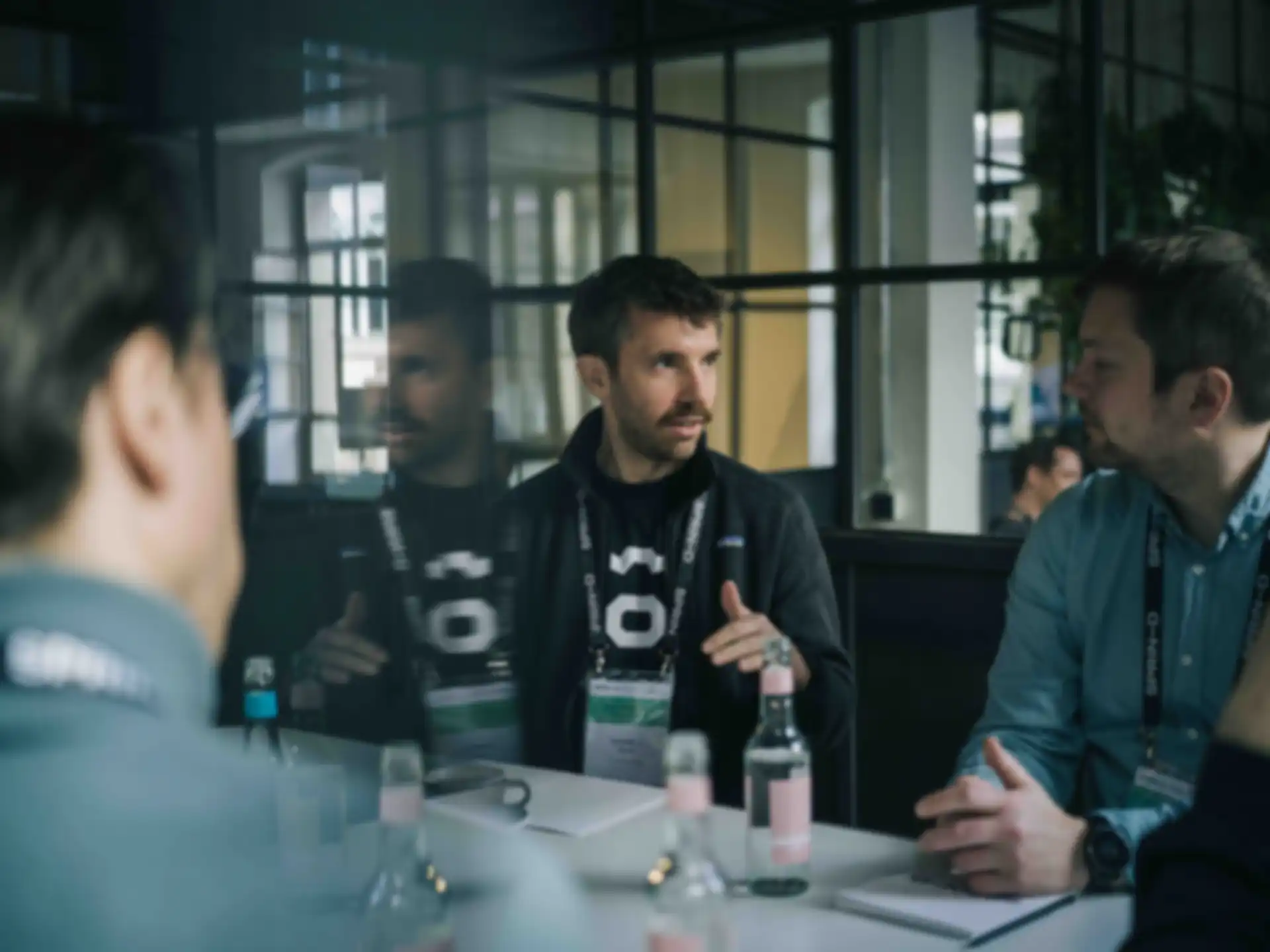 Three people in conversation.