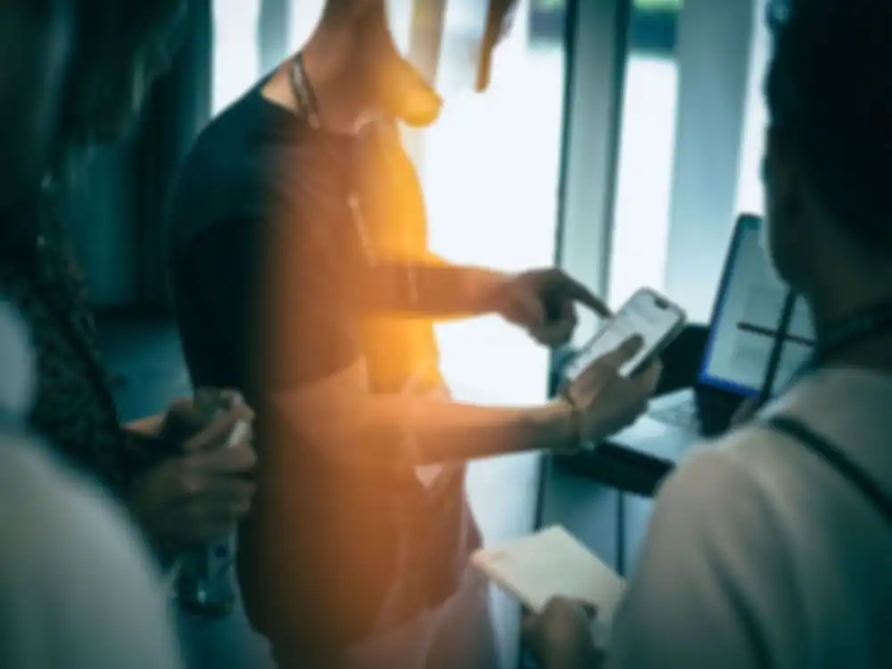 A man is using a smartphone on which you can see a EUDI Wallet Prototype