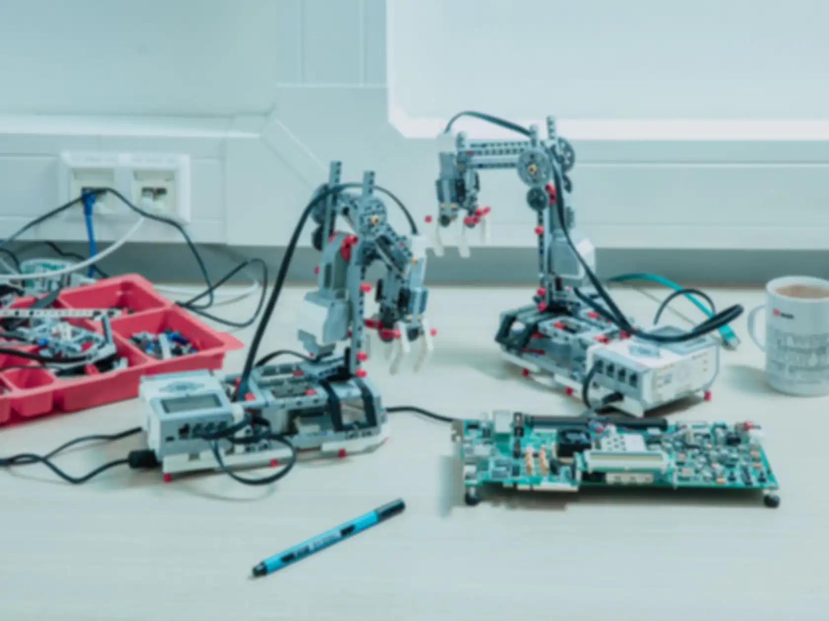 A workspace with two toy excavators