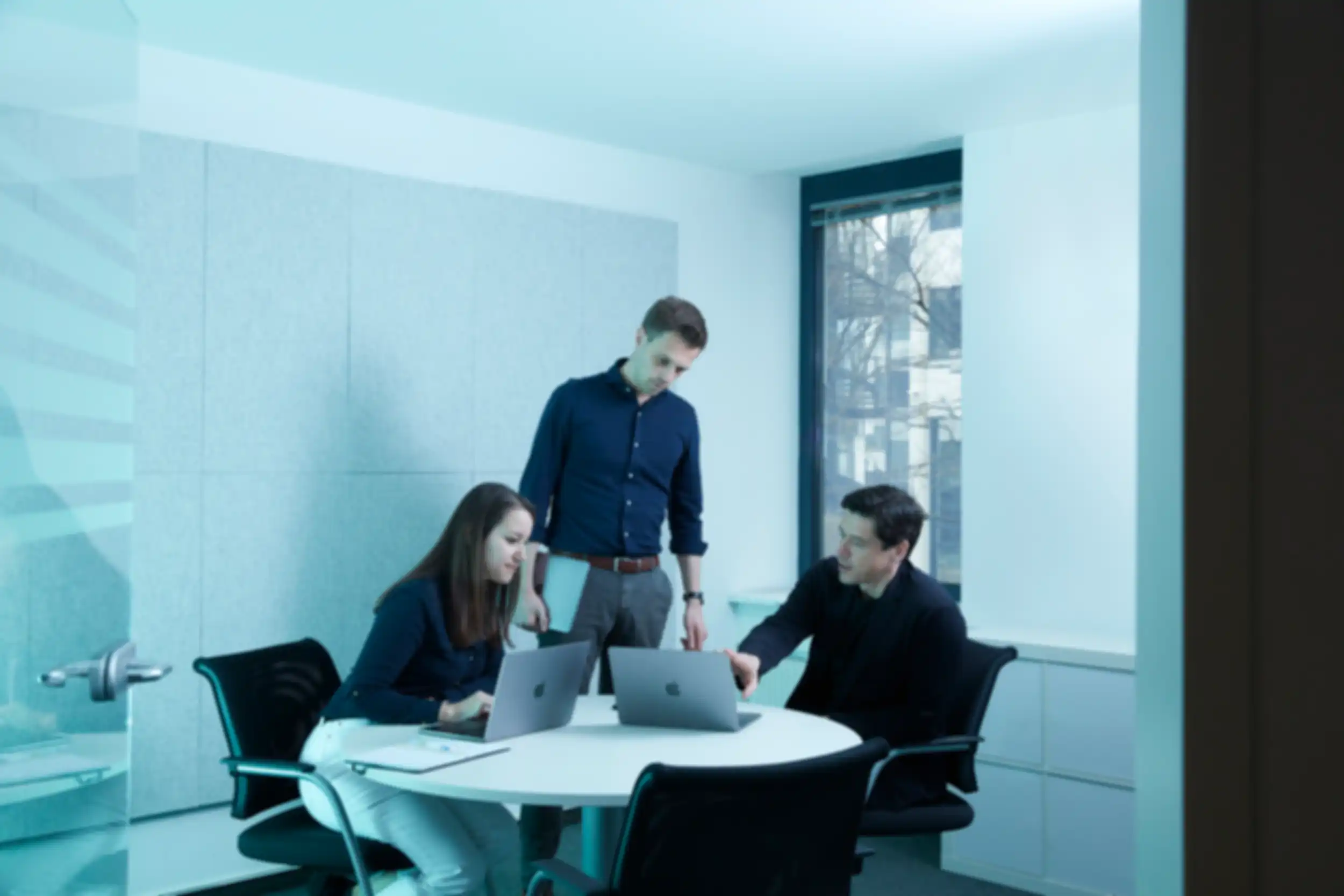 Three team members in a meeting