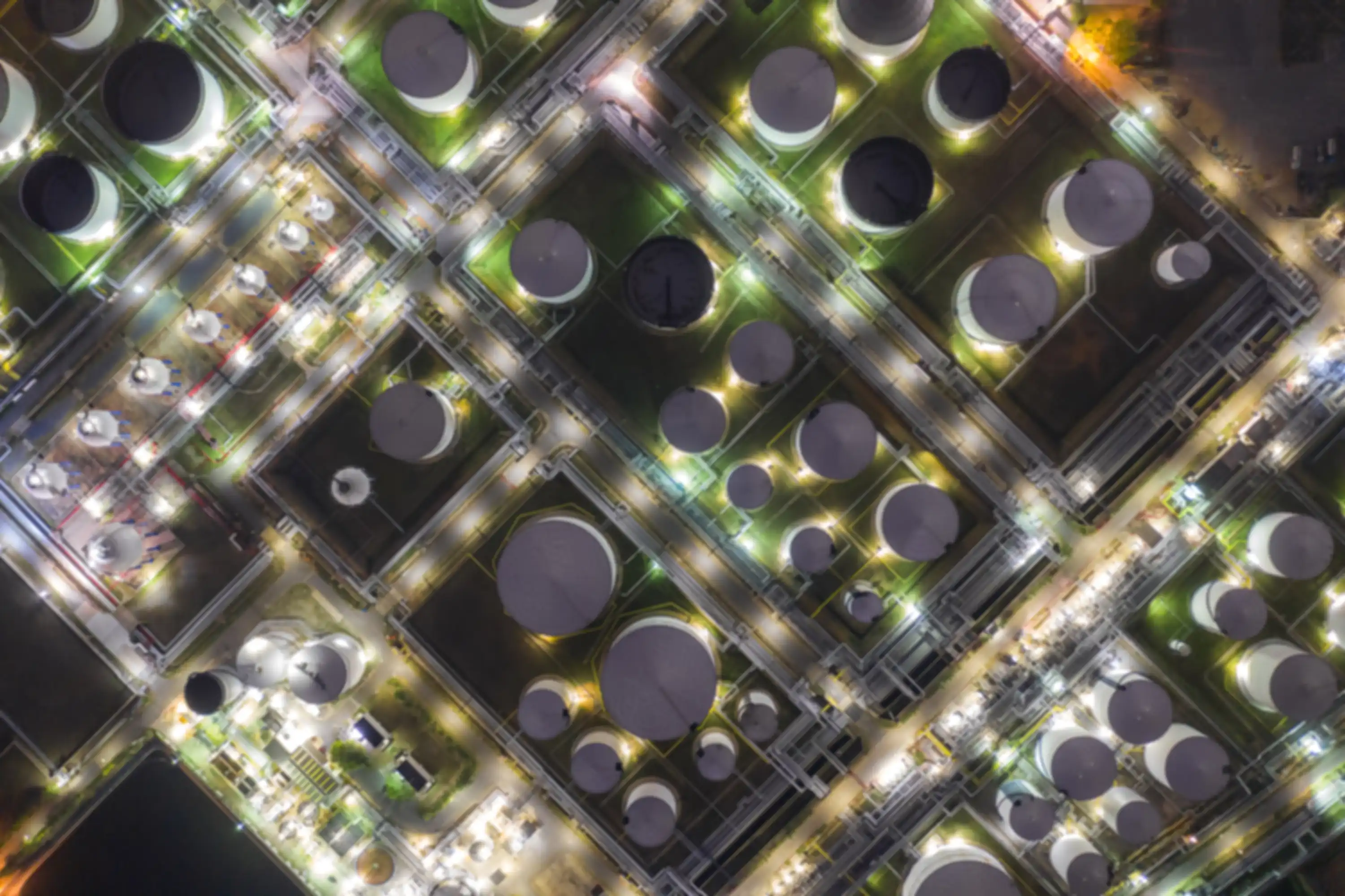Animated image of a factory complex seen from the air at night