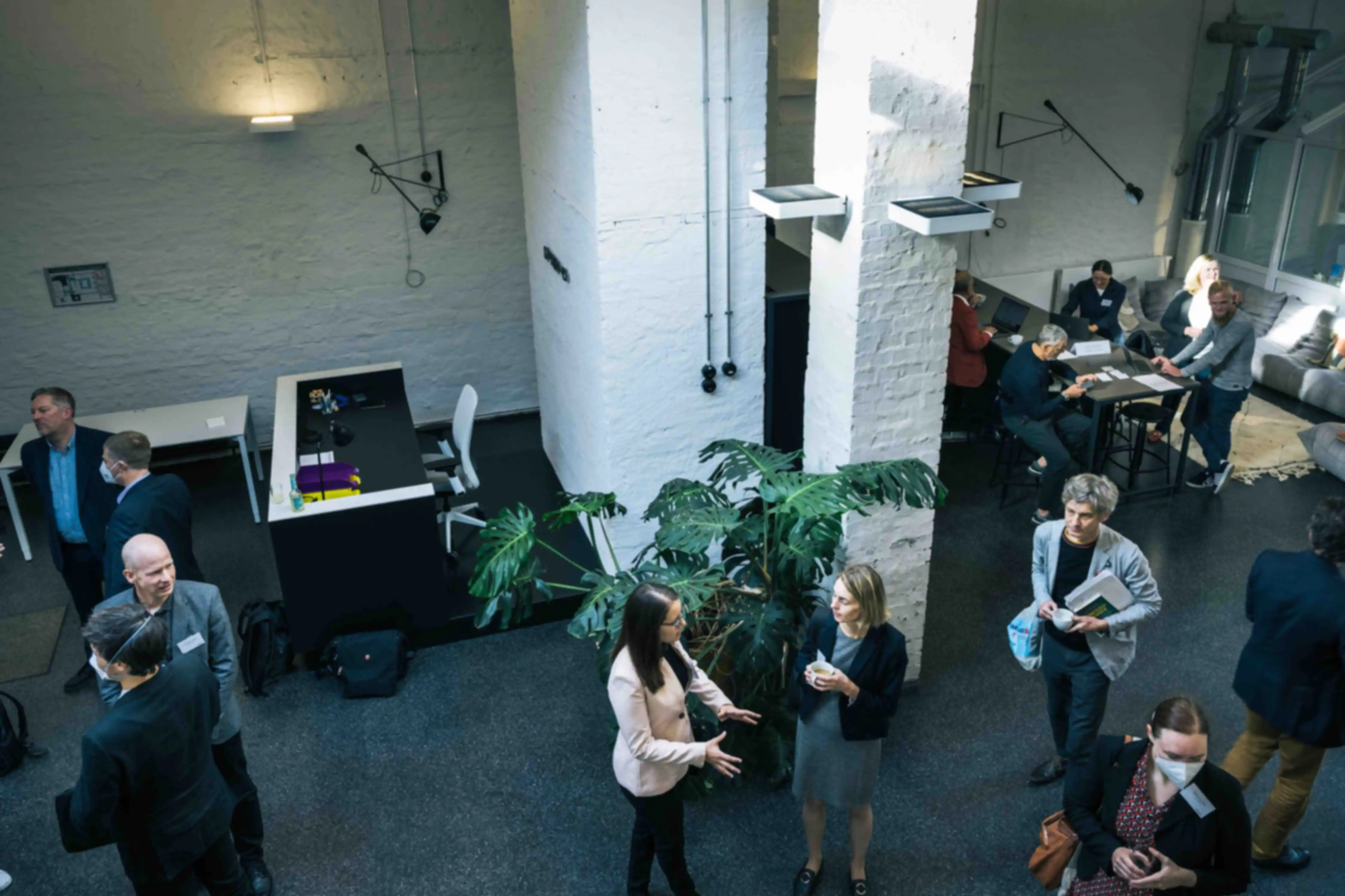 Several people in conversation at SPRIND headquarters