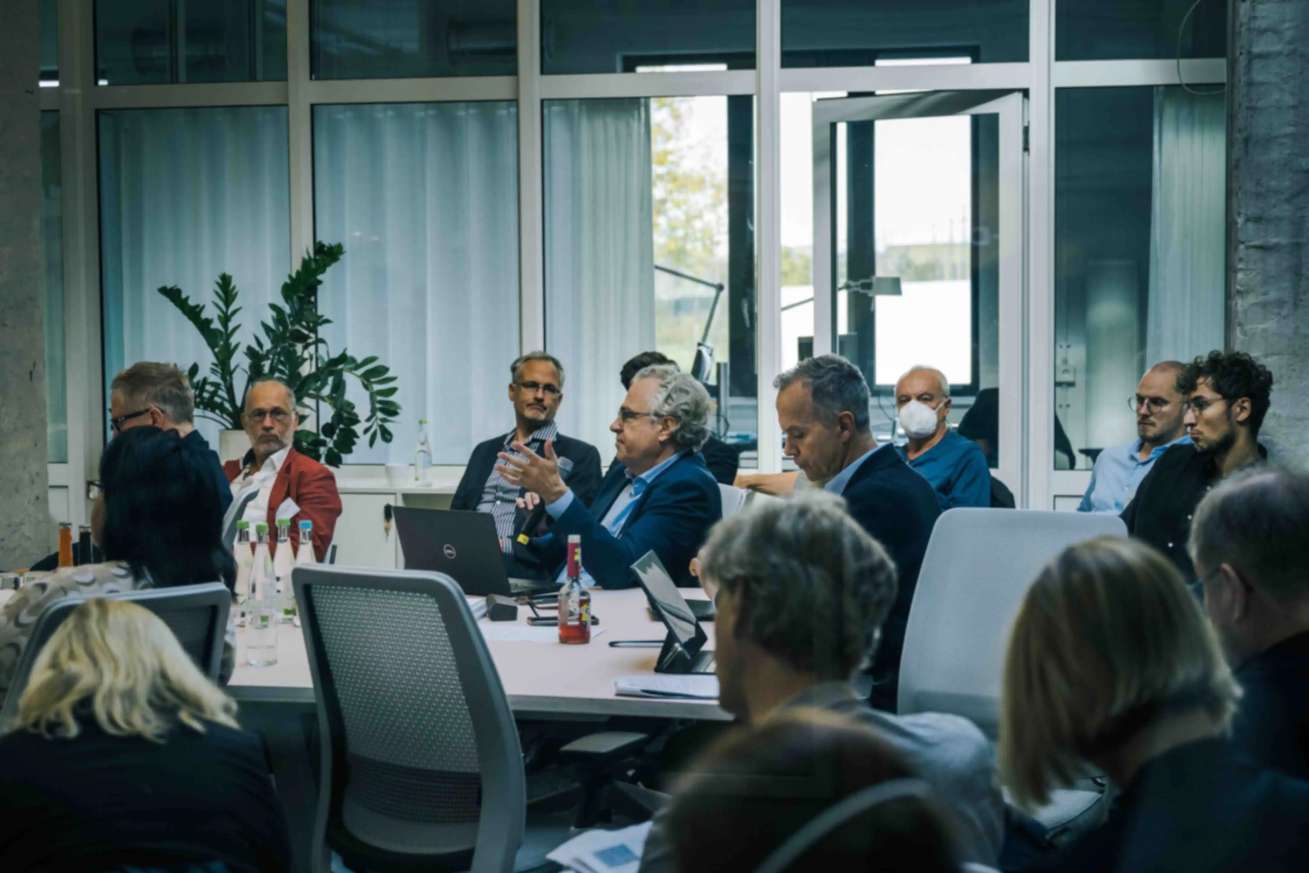 A few people in a group meeting at SPRIND headquarters