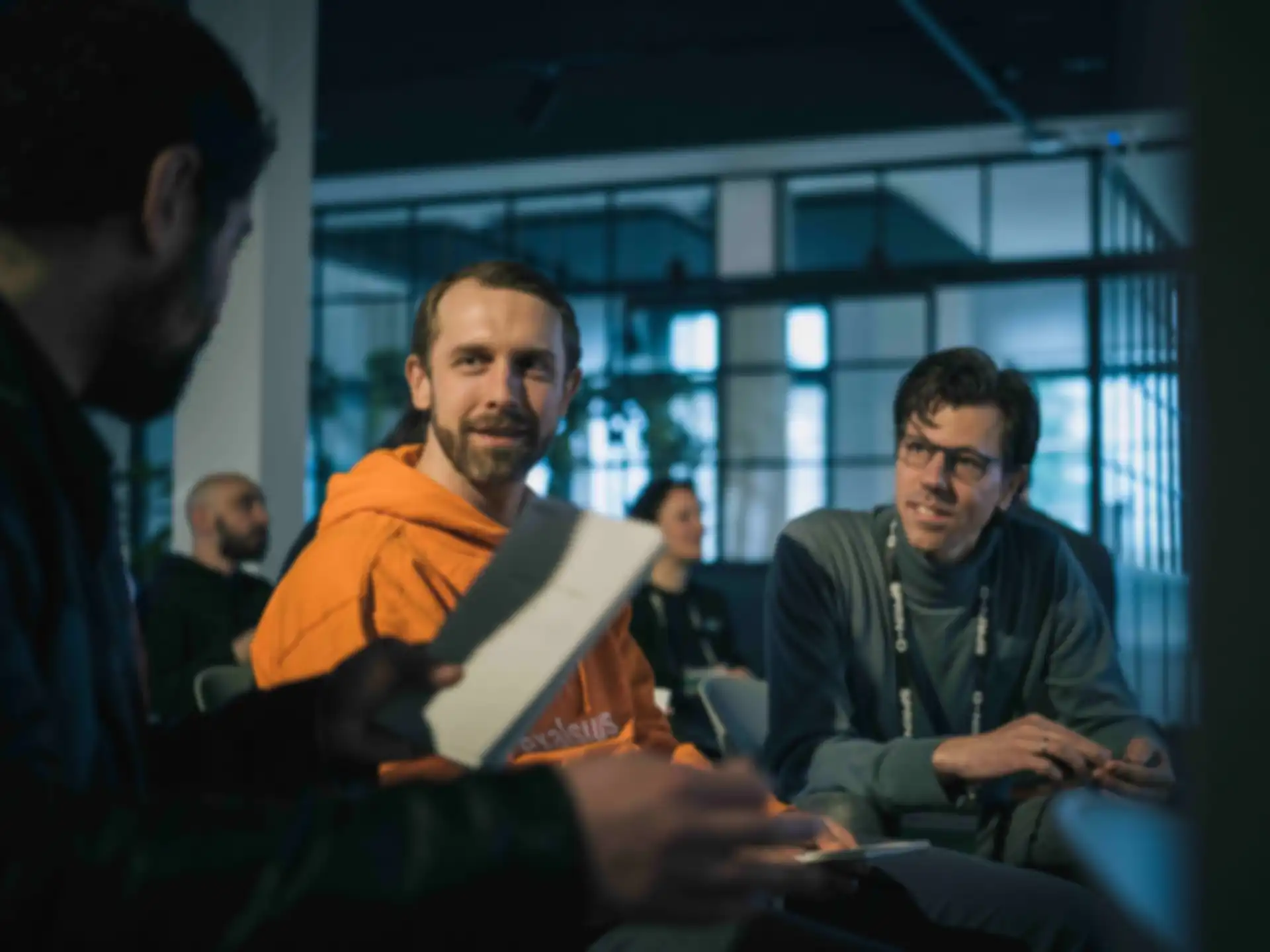Three people in conversation.